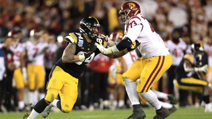 SAN DIEGO, CALIFORNIA – DECEMBER 27: Austin Jackson #73 of the USC Trojans blocks A.J. Epenesa #94 of the Iowa Hawkeyes during the second half of the San Diego County Credit Union Holiday Bowl at SDCCU Stadium on December 27, 2019 in San Diego, California. (Photo by Sean M. Haffey/Getty Images)