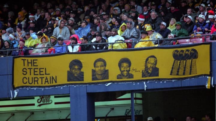 PITTSBURGH - DECEMBER 16: A sign for the Steel Curtain, (a name given to the defensive line of the Pittsburgh Steelers in the 1970s) from left, Dwight White, Ernie Holmes, Joe Greene and L.C. Greenwood, hangs from the stands during a game against the Washington Redskins at Three Rivers Stadium on December 16, 2000 in Pittsburgh, Pennsylvania. (Photo by George Gojkovich/Getty Images)