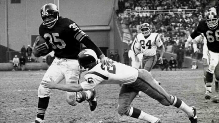 Hall of Fame halfback John Henry Johnson of the Pittsburgh Steelers runs upfield as fellow hall of famer Paul Krause attempts to tackle in a 14 to 7 win over the Washington Redskins on December 6, 1964 at D. C. Stadium in Washington DC. (Photo by Nate Fine/Getty Images) *** Local Caption *** Hall of Fame halfback John Henry Johnson of the Pittsburgh Steelers runs upfield as fellow hall of famer Paul Krause attempts to tackle in a 14 to 7 win over the Washington Redskins on December 6, 1964 at D. C. Stadium in Washington DC. (Photo by Nate Fine/Getty Images) *** Local Caption ***