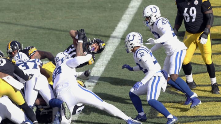 Pittsburgh Steelers running back James Conner (30) falls backward into the end-zone to score a one yard touchdown against the Indianapolis Colts during the second quarter at Heinz Field. Mandatory Credit: Charles LeClaire-USA TODAY Sports