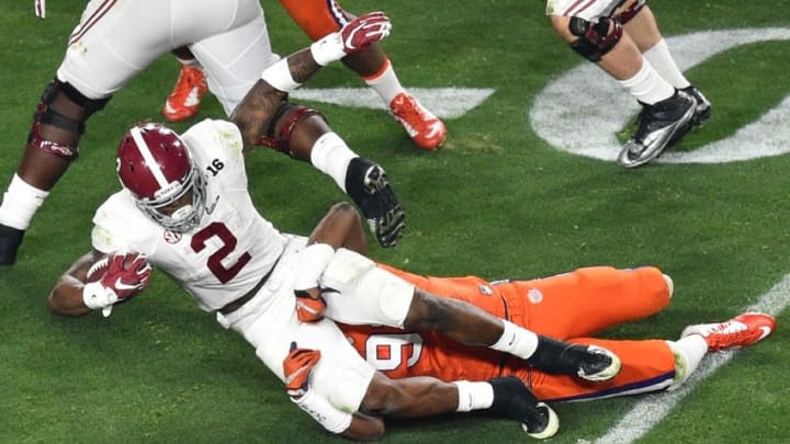 Jan 11, 2016; Glendale, AZ, USA; Alabama Crimson Tide running back Derrick Henry (2) is brought down by Clemson Tigers defensive end Shaq Lawson (90) during the first quarter in the 2016 CFP National Championship at University of Phoenix Stadium. Mandatory Credit: Gary A. Vasquez-USA TODAY Sports