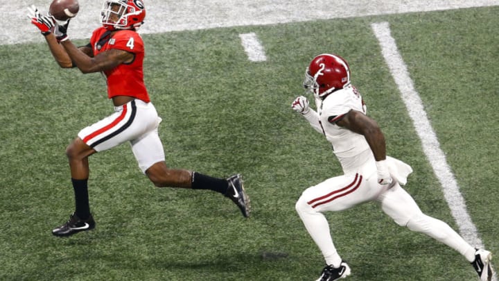 ATLANTA, GA - JANUARY 08: Wide receiver Mecole Hardman #4 catches a pass for a touchdown behind safety Tony Brown #2 of the Alabama Crimson Tide during the College Football Playoff National Championship game at Mercedes-Benz Stadium on January 8, 2018 in Atlanta, Georgia. (Photo by Mike Zarrilli/Getty Images)