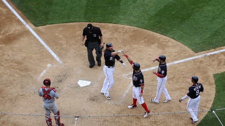 May 29, 2016; Washington, DC, USA; Washington Nationals left fielder Jayson Werth (28) is congratulated by left fielder Ben Revere (9) and shortstop Danny Espinosa (8) and catcher Wilson Ramos (40) after hitting a grand slam against the St. Louis Cardinals during the seventh inning at Nationals Park. Mandatory Credit: Brad Mills-USA TODAY Sports