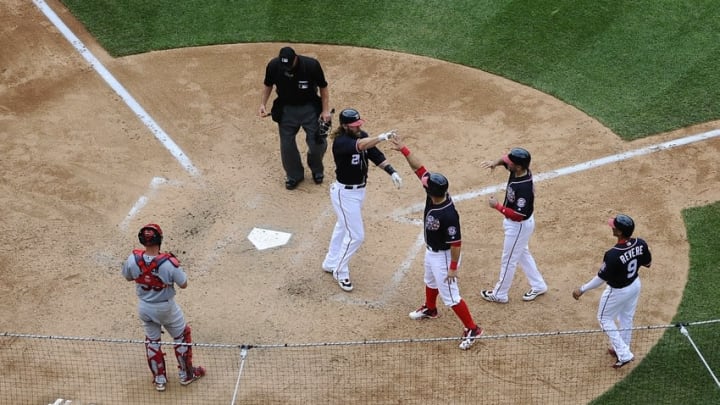 May 29, 2016; Washington, DC, USA; Washington Nationals left fielder Jayson Werth (28) is congratulated by left fielder Ben Revere (9) and shortstop Danny Espinosa (8) and catcher Wilson Ramos (40) after hitting a grand slam against the St. Louis Cardinals during the seventh inning at Nationals Park. Mandatory Credit: Brad Mills-USA TODAY Sports