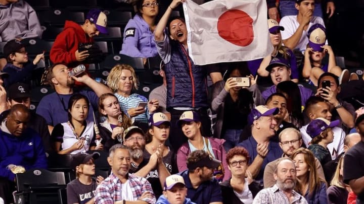 Aug 5, 2016; Denver, CO, USA; A fan displays the flag of Japan in the seventh inning of the game between the Colorado Rockies and the Miami Marlins at Coors Field. Mandatory Credit: Isaiah J. Downing-USA TODAY Sports