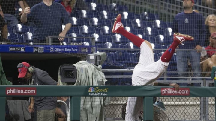 PHILADELPHIA, PA - SEPTEMBER 11: Maikel Franco #7 of the Philadelphia Phillies falls over the camera fence reaching for a foul ball in the top of the eighth inning against the Washington Nationals in game 2 of the doubleheader at Citizens Bank Park on September 11, 2018 in Philadelphia, Pennsylvania. The Nationals defeated the Phillies 7-6. (Photo by Mitchell Leff/Getty Images)