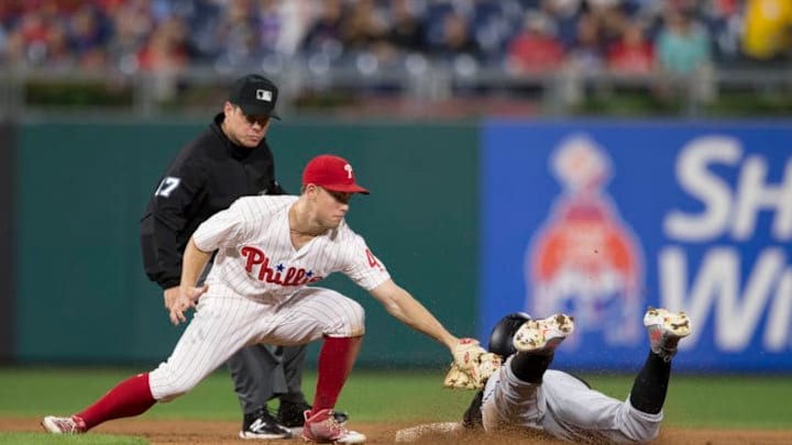 PHILADELPHIA, PA - SEPTEMBER 14: Scott Kingery #4 of the Philadelphia Phillies tags out Rafael Ortega #52 of the Miami Marlins in the top of the fifth inning trying to stretch a single into a double at Citizens Bank Park on September 14, 2018 in Philadelphia, Pennsylvania. The Phillies defeated the Marlins 14-2. (Photo by Mitchell Leff/Getty Images)
