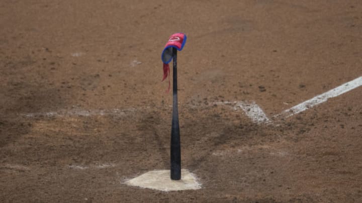 A bat rests on home plate during a game between the Washington Nationals and Philadelphia Phillies (Photo by Mitchell Leff/Getty Images)