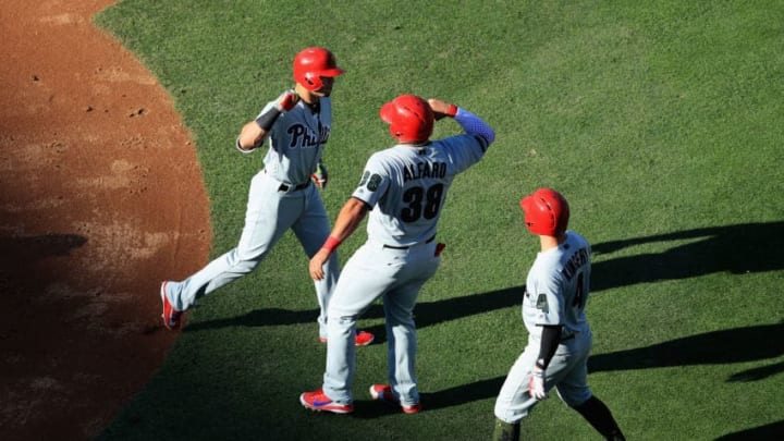 LOS ANGELES, CA - MAY 28: Scott Kingery #4, and Jorge Alfaro #38 congratulate Cesar Hernandez #16 of the Philadelphia Phillies after he hit a three-run homerun during the second inning of a game against the Los Angeles Dodgers at Dodger Stadium on May 28, 2018 in Los Angeles, California. MLB players across the league are wearing special uniforms to commemorate Memorial Day. (Photo by Sean M. Haffey/Getty Images)