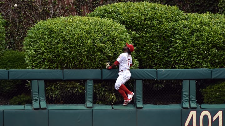 May 26, 2017; Philadelphia, PA, USA; Philadelphia Phillies center fielder Odubel Herrera (37) leaps and watches as a home run ball hit by Cincinnati Reds right fielder Scott Schebler (not shown) during the second inning of the game at Citizens Bank Park. Mandatory Credit: John Geliebter-USA TODAY Sports