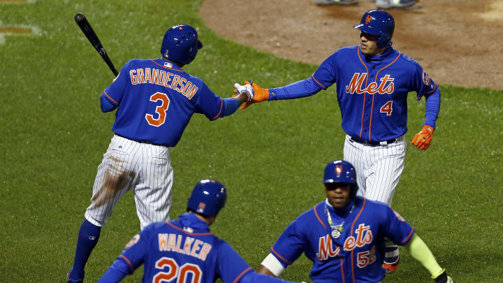 Apr 6, 2017; New York City, NY, USA; New York Mets third baseman Wilmer Flores (4) celebrates with Mets right fielder Curtis Granderson (3) after hitting a two-run home run against the Atlanta Braves during the sixth inning at Citi Field. Mandatory Credit: Adam Hunger-USA TODAY Sports