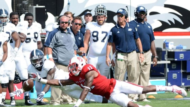 Aug 30, 2014; Raleigh, NC: North Carolina State Wolfpack cornerback Justin Burris (11) knocks down a pass in front of Georgia Southern Eagles receiver B.J. Johnson (12) during the second half at Carter Finley Stadium. North Carolina State won 24-23. Mandatory Credit: Rob Kinnan-USA Today