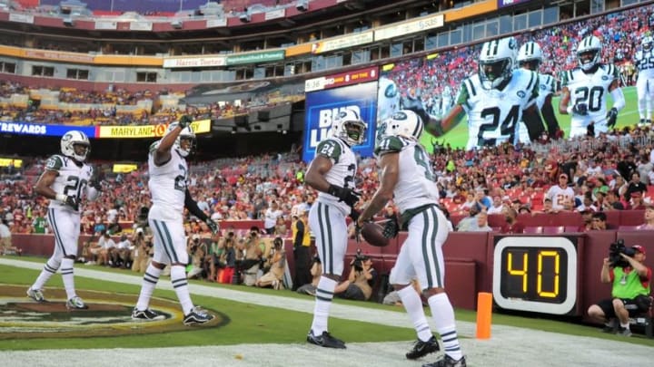 Aug 19, 2016; Landover, MD, USA; New York Jets cornerback Darrelle Revis (24) celebrates with teammates after making an interception in the first quarter against the Washington Redskins at FedEx Field. Mandatory Credit: Evan Habeeb-USA TODAY Sports