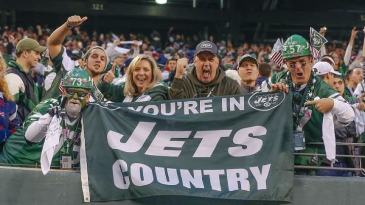 Dec 27, 2015; East Rutherford, NJ, USA; New York Jets fans celebrate an overtime victory over the New England Patriots at MetLife Stadium. New York Jets defeat the New England Patriots 26-20 in OT. Mandatory Credit: Jim O