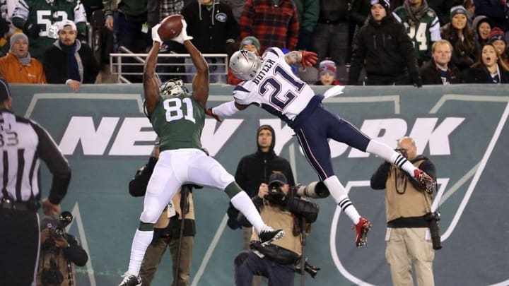 Nov 27, 2016; East Rutherford, NJ, USA; New York Jets wide receiver Quincy Enunwa (81) catches a touchdown pass over New England Patriots corner back Malcolm Butler (21) during the fourth quarter at MetLife Stadium. Mandatory Credit: Brad Penner-USA TODAY Sports