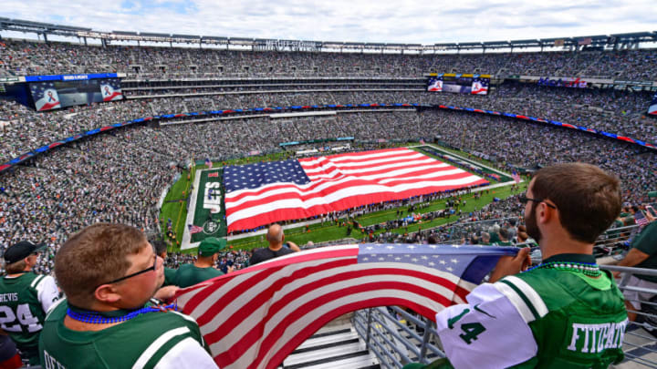 EAST RUTHERFORD, NJ - SEPTEMBER 11: Fans hold an American flag during the National Anthem prior to the game between the New York Jets and the Cincinnati Bengals at MetLife Stadium on September 11, 2016 in East Rutherford, New Jersey. (Photo by Steven Ryan/Getty Images)