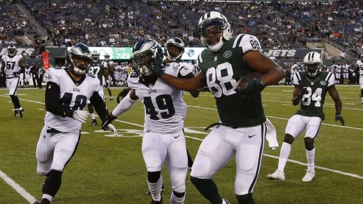 EAST RUTHERFORD, NJ - AUGUST 31: Austin Seferian-Jenkins #88 of the New York Jets fends off Tre Sullivan #49 of the Philadelphia Eagles during their preseason game at MetLife Stadium on August 31, 2017 in East Rutherford, New Jersey. (Photo by Jeff Zelevansky/Getty Images)