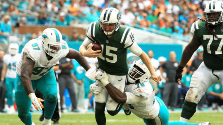 MIAMI GARDENS, FL – OCTOBER 22: Josh McCown #15 of the New York Jets tackled by Jordan Phillips #97 and Terrence Fede #78 of the Miami Dolphins during the third quarter at Hard Rock Stadium on October 22, 2017 in Miami Gardens, Florida. (Photo by Mike Ehrmann/Getty Images)