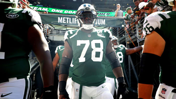 EAST RUTHERFORD, NJ – SEPTEMBER 24: Jonotthan Harrison #78 of the New York Jets walk out of the tunnel prior to an NFL game against the Miami Dolphins at MetLife Stadium on September 24, 2017 in East Rutherford, New Jersey. (Photo by Al Bello/Getty Images)