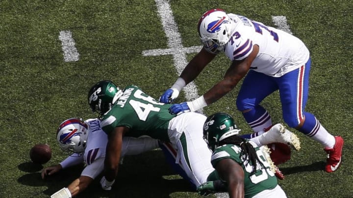 EAST RUTHERFORD, NJ - SEPTEMBER 8: Josh Allen #17 of the Buffalo Bills fumbles under pressure from Jordan Jenkins #48 of the New York Jets during their game at MetLife Stadium on September 8, 2019 in East Rutherford, New Jersey. (Photo by Jeff Zelevansky/Getty Images)