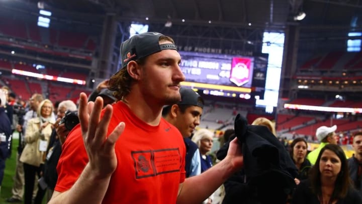 Jan 1, 2016; Glendale, AZ, USA; Ohio State Buckeyes defensive lineman Joey Bosa reacts as he walks off the field following the game against the Notre Dame Fighting Irish during the 2016 Fiesta Bowl at University of Phoenix Stadium. The Buckeyes defeated the Fighting Irish 44-28. Bosa was ejected in the first quarter for targeting. Mandatory Credit: Mark J. Rebilas-USA TODAY Sports