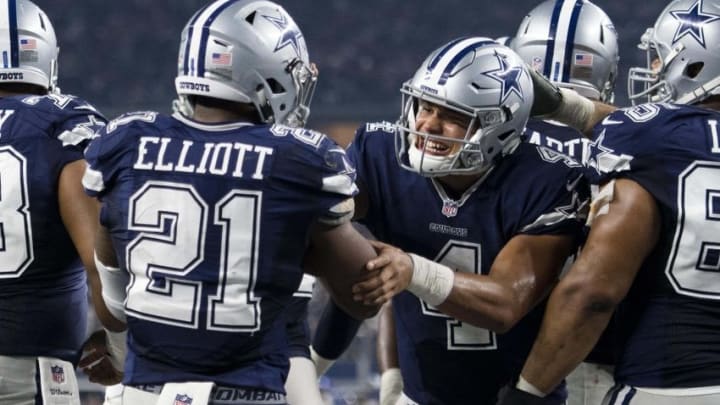 Nov 24, 2016; Arlington, TX, USA; Dallas Cowboys running back Ezekiel Elliott (21) and quarterback Dak Prescott (4) celebrate Elliott