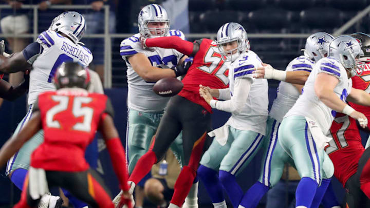 ARLINGTON, TEXAS - AUGUST 29: Mike White #3 of the Dallas Cowboys fumbles the ball against the Tampa Bay Buccaneers in the first quarter of a NFL preseason game at AT&T Stadium on August 29, 2019 in Arlington, Texas. (Photo by Tom Pennington/Getty Images)