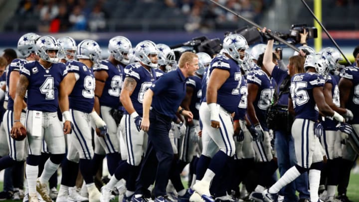ARLINGTON, TX - NOVEMBER 23: The Dallas Cowboys led by head coach Jason Garrett head back to the locker room after warming up before the game against the Los Angeles Chargers at AT
