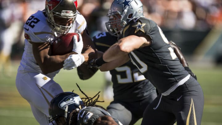 HONOLULU, HI - SUNDAY, JANUARY 31: Team Rice running back Doug Martin #22 of the Tampa Bay Buccaneers is stopped by Team Irvin cornerback Richard Sherman #25 of the Seattle Seahawks and Sean Lee #50 of the Dallas Cowboys during the first half of the 2016 Pro Bowl at Aloha Stadium on January 31, 2016 in Honolulu, Hawaii. (Photo by Kent Nishimura/Getty Images)