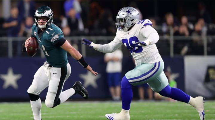 ARLINGTON, TX - NOVEMBER 19: Carson Wentz #11 of the Philadelphia Eagles is pursued by Maliek Collins #96 of the Dallas Cowboys in the first quarter of a football game at AT&T Stadium on November 19, 2017 in Arlington, Texas. (Photo by Tom Pennington/Getty Images)