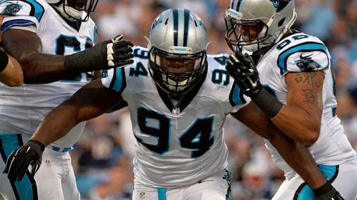 CHARLOTTE, NC - AUGUST 28: Kony Ealy #94 of the Carolina Panthers celebrates a 1st quarter sack against the New England Patriots during their preseason NFL game at Bank of America Stadium on August 28, 2015 in Charlotte, North Carolina. (Photo by Grant Halverson/Getty Images)