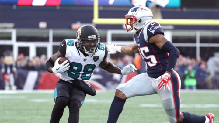 FOXBOROUGH, MA - JANUARY 21: Allen Hurns #88 of the Jacksonville Jaguars carries the ball after a catch as he is defended by Eric Rowe #25 of the New England Patriots in the second half of the AFC Championship Game at Gillette Stadium on January 21, 2018 in Foxborough, Massachusetts. (Photo by Maddie Meyer/Getty Images)