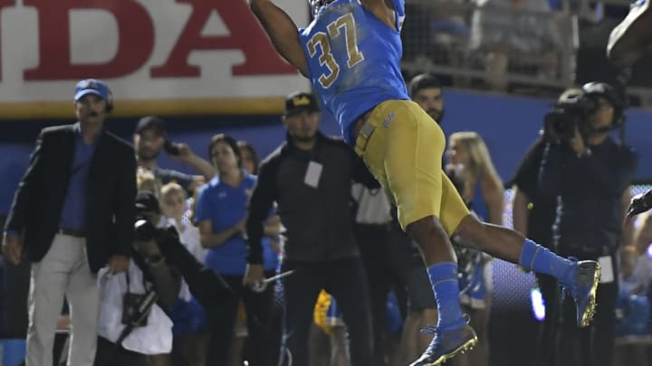 PASADENA, CA – OCTOBER 26: Quentin Lake #37 of the UCLA Bruins intercepts the ball in the endzone against Utah Utes at the Rose Bowl on October 26, 2018 in Pasadena, California. (Photo by John McCoy/Getty Images)