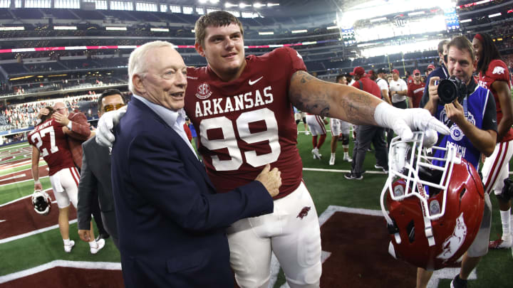 ARLINGTON, TX – SEPTEMBER 25: Dallas Cowboys owner and general manager Jerry Jones celebrates with John Ridgeway #99 of the Arkansas Razorbacks following the team’s 20-10 win over the Texas A&M Aggies in the Southwest Classic at AT&T Stadium on September 25, 2021, in Arlington, Texas. (Photo by Ron Jenkins/Getty Images)