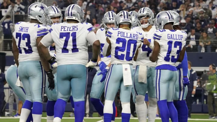 ARLINGTON, TEXAS - DECEMBER 11: The Dallas Cowboys offense huddles in the second quarter of a game against the Houston Texans at AT&T Stadium on December 11, 2022 in Arlington, Texas. (Photo by Sam Hodde/Getty Images)