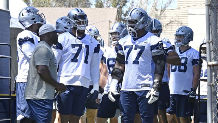 OXNARD, CA - AUGUST 03: Offensive tackle La'el Collins #71 and offensive tackle Tyron Smith #77 of the Dallas Cowboys wait to enter the field for training camp at River Ridge Complex on August 3, 2021 in Oxnard, California. (Photo by Jayne Kamin-Oncea/Getty Images)