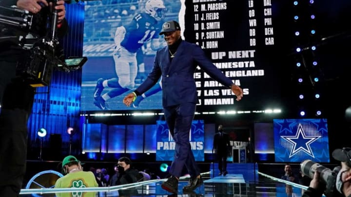 Apr 29, 2021; Cleveland, Ohio, USA; Micah Persons (Penn State) walks on stage after being selected by the Dallas Cowboys as the number 12 overall pick in the first round of the 2021 NFL Draft at First Energy Stadium. Mandatory Credit: Kirby Lee-USA TODAY Sports