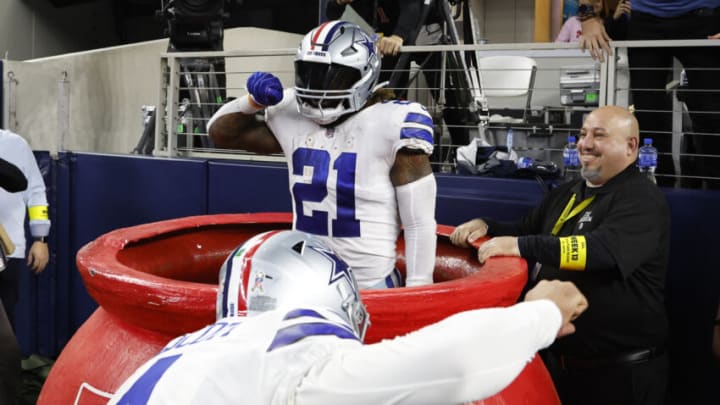 Dec 4, 2022; Arlington, Texas, USA; Dallas Cowboys running back Ezekiel Elliott (21) and quarterback Dak Prescott (4) celebrate a touchdown against the Indianapolis Colts in the fourth quarter at AT&T Stadium. Mandatory Credit: Tim Heitman-USA TODAY Sports