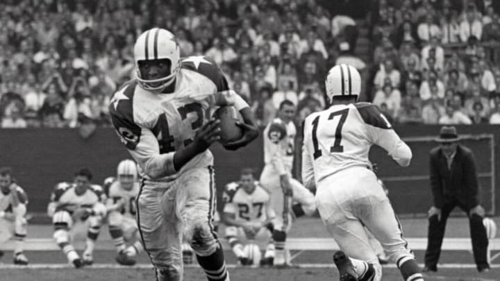 Unknown date; Cleveland, OH, USA; FILE PHOTO; Dallas Cowboys running back Don Perkins (43) runs after a hand-off from quarterback Don Meredith (17) during a game against the Cleveland Browns at Cleveland Stadium. Perkins won rookie of the year in 1961, was the first Cowboy to reach 6,000 yards rushing and scored 45 touchdowns in his eight year NFL career. Mandatory Credit: Malcolm Emmons-USA TODAY Sports