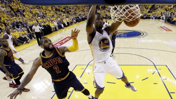 Jun 2, 2016; Oakland, CA, USA; Golden State Warriors forward Harrison Barnes (40) dunks the ball against Cleveland Cavaliers guard Kyrie Irving (2) in game one of the NBA Finals at Oracle Arena. Mandatory Credit: Marcio Jose Sanchez-Pool Photo via USA TODAY Sports