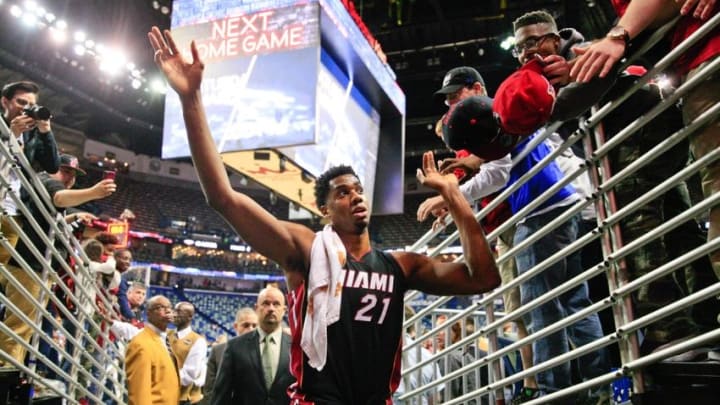 Mar 22, 2016; New Orleans, LA, USA; Miami Heat center Hassan Whiteside (21) celebrates with fans following a win against the New Orleans Pelicans in a game at the Smoothie King Center. The Heat defeated the Pelicans 113-99. Mandatory Credit: Derick E. Hingle-USA TODAY Sports