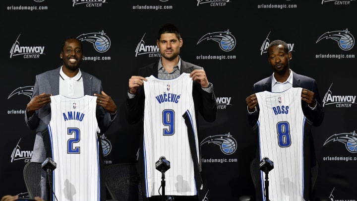 ORLANDO, FL – JULY 8: Al-Farouq Aminu #28, Nikola Vucevic #9, and Terrence Ross #8 of the Orlando Magic pose for a photo during a press conference on July 8, 2019 at Amway Center in Orlando, Florida. NOTE TO USER: User expressly acknowledges and agrees that, by downloading and or using this photograph, User is consenting to the terms and conditions of the Getty Images License Agreement. Mandatory Copyright Notice: Copyright 2019 NBAE (Photo by Fernando Medina/NBAE via Getty Images)