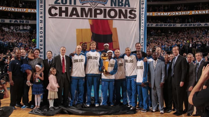 DALLAS, TX – DECEMBER 25: The Dallas Mavericks pose for a photo as they raise their 2010-2011 Championship banner to the rafters on December 25, 2011 at the American Airlines Center in Dallas, Texas. NOTE TO USER: User expressly acknowledges and agrees that, by downloading and or using this photograph, User is consenting to the terms and conditions of the Getty Images License Agreement. Mandatory Copyright Notice: Copyright 2011 NBAE (Photo by Danny Bollinger/NBAE via Getty Images)