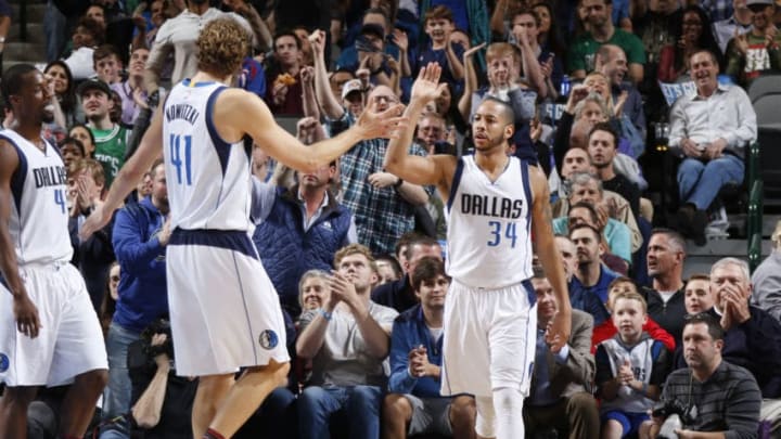 DALLAS, TX - FEBRUARY 13: Dirk Nowitzki #41 and Devin Harris #34 of the Dallas Mavericks celebrate during a game against the Boston Celtics on February 13, 2017 at American Airlines Center in Dallas, Texas. NOTE TO USER: User expressly acknowledges and agrees that, by downloading and/or using this photograph, user is consenting to the terms and conditions of the Getty Images License Agreement. Mandatory Copyright Notice: Copyright 2017 NBAE (Photo by Danny Bollinger/NBAE via Getty Images)
