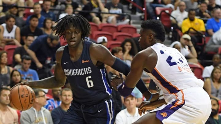 LAS VEGAS, NV - JULY 06: Johnathan Motley #6 of the Dallas Mavericks drives to the basket against Deandre Ayton #22 of the Phoenix Suns during the 2018 NBA Summer League at the Thomas & Mack Center on July 6, 2018 in Las Vegas, Nevada. The Suns defeated the Mavericks 92-85. NOTE TO USER: User expressly acknowledges and agrees that, by downloading and or using this photograph, User is consenting to the terms and conditions of the Getty Images License Agreement. (Photo by Ethan Miller/Getty Images)
