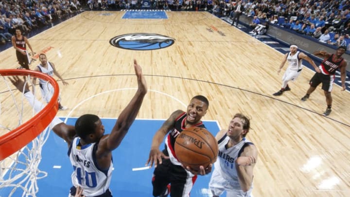 DALLAS, TX - FEBRUARY 7: Damian Lillard #0 of the Portland Trail Blazers goes in for the lay up against the Dallas Mavericks on February 7, 2017 at the American Airlines Center in Dallas, Texas. NOTE TO USER: User expressly acknowledges and agrees that, by downloading and or using this photograph, User is consenting to the terms and conditions of the Getty Images License Agreement. Mandatory Copyright Notice: Copyright 2017 NBAE (Photo by Glenn James/NBAE via Getty Images)