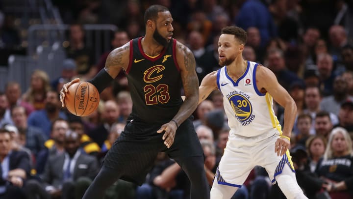 CLEVELAND, OH – JANUARY 15: LeBron James #23 of the Cleveland Cavaliers dribbles the ball against Stephen Curry #30 of the Golden State Warriors at Quicken Loans Arena on January 15, 2018 in Cleveland, Ohio. NOTE TO USER: User expressly acknowledges and agrees that, by downloading and or using this photograph, User is consenting to the terms and conditions of the Getty Images License Agreement.(Photo by Michael Hickey/Getty Images)