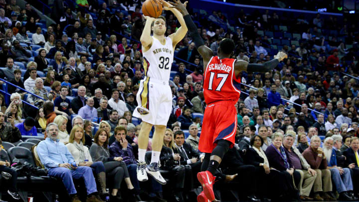 Feb 2, 2015; New Orleans, LA, USA; New Orleans Pelicans guard Jimmer Fredette (32) shoots over Atlanta Hawks guard Dennis Schroder (17) during the first quarter of a game at the Smoothie King Center. The Pelicans defeated the Hawks 115-100. Mandatory Credit: Derick E. Hingle-USA TODAY Sports