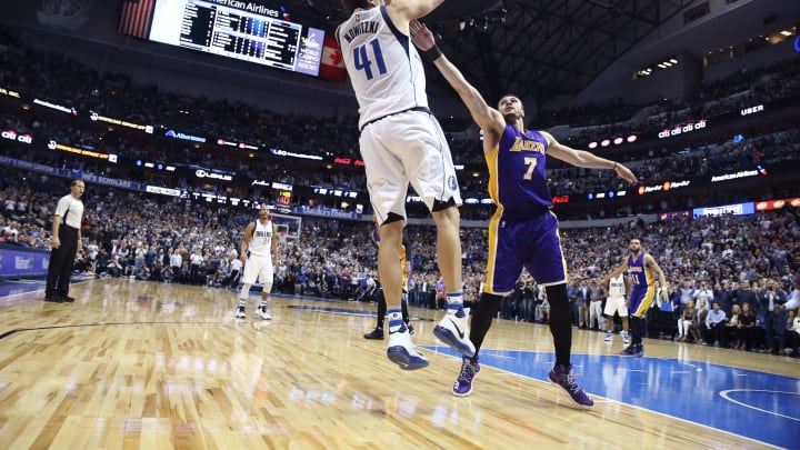 Mar 7, 2017; Dallas, TX, USA; Dallas Mavericks forward Dirk Nowitzki (41) scores his 30,000th point over Los Angeles Lakers forward Larry Nance Jr. (7) during the second quarter at American Airlines Center. Mandatory Credit: Kevin Jairaj-USA TODAY Sports