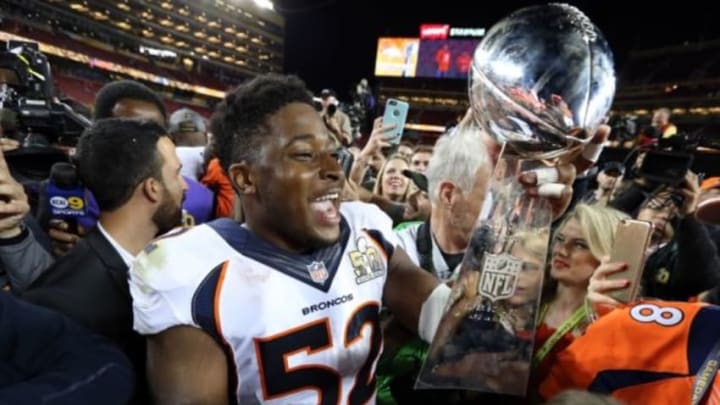 Feb 7, 2016; Santa Clara, CA, USA; Denver Broncos outside linebacker Corey Nelson (52) celebrates with the Vince Lombardi Trophy after beating the Carolina Panthers in Super Bowl 50 at Levi